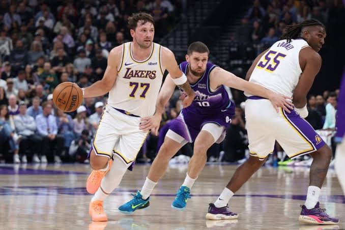 Luka Doncic drives past a Utah Jazz defender on his way to 52 points in the Lakers' 132-123 win in Salt Lake City.