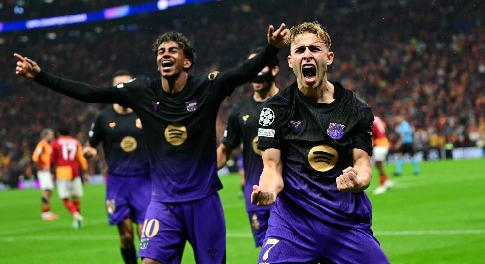 Fermín López celebrates with Lamine Yamal after heading Barcelona into a 2-1 lead against Galatasaray in the UEFA Champions League.