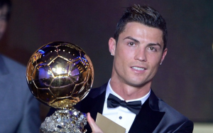 Cristiano Ronaldo holds the Ballon d'Or trophy, as fans voted his 2008 season the best Ballon d'Or of all time.